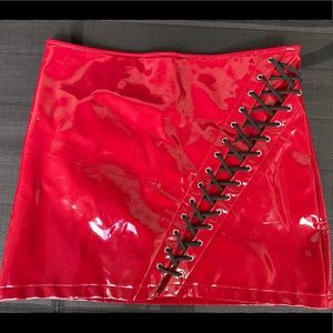 Horoscopez Red vinyl shirt with lace up on front